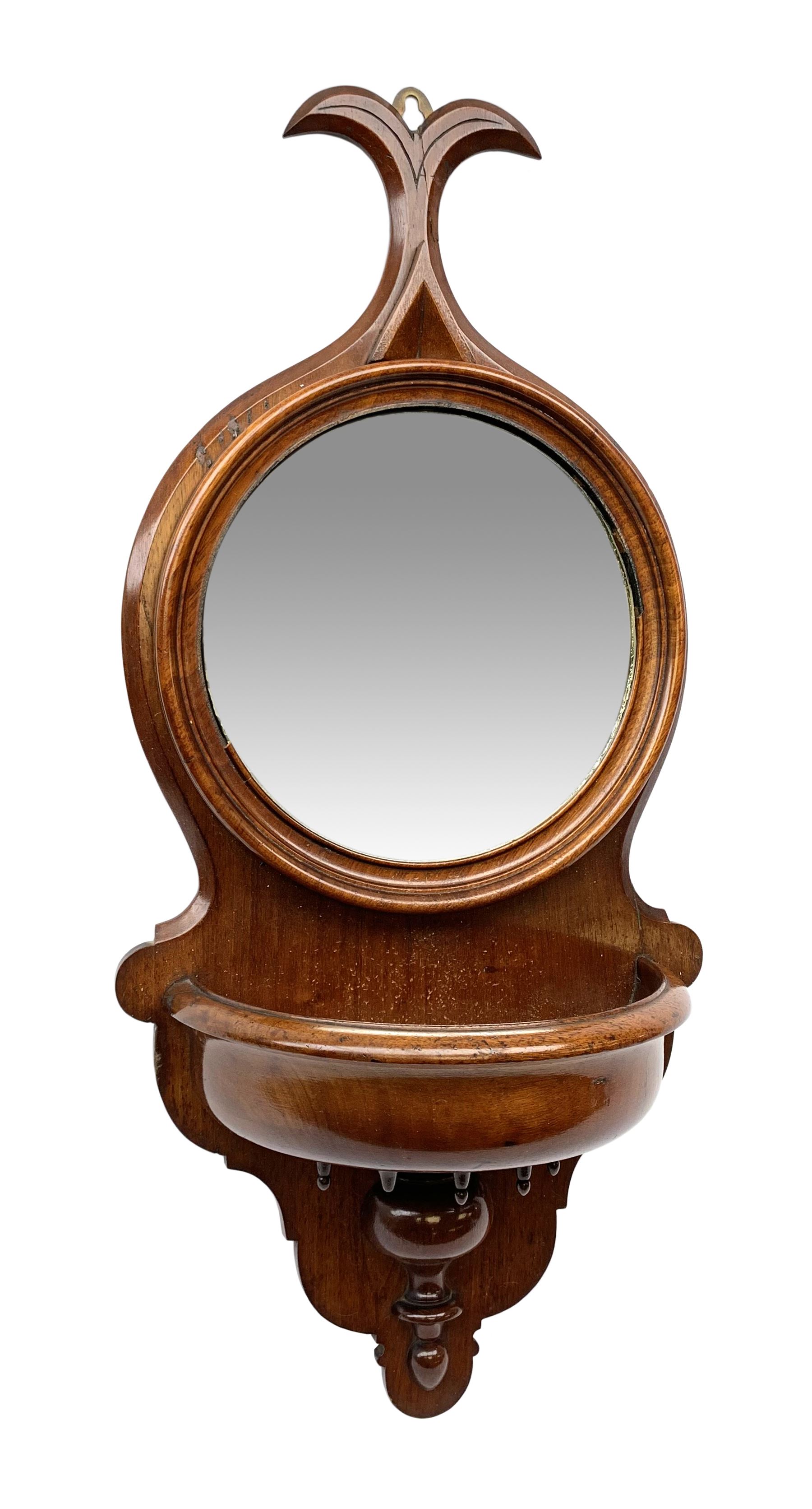 Victorian mahogany mirror backed wall bracket in the form of a stoop, the circular mirror plate set
