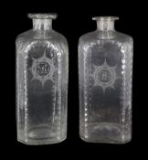 Pair of early 19th century square section decanters, with oval faceted borders and engraved sun burs