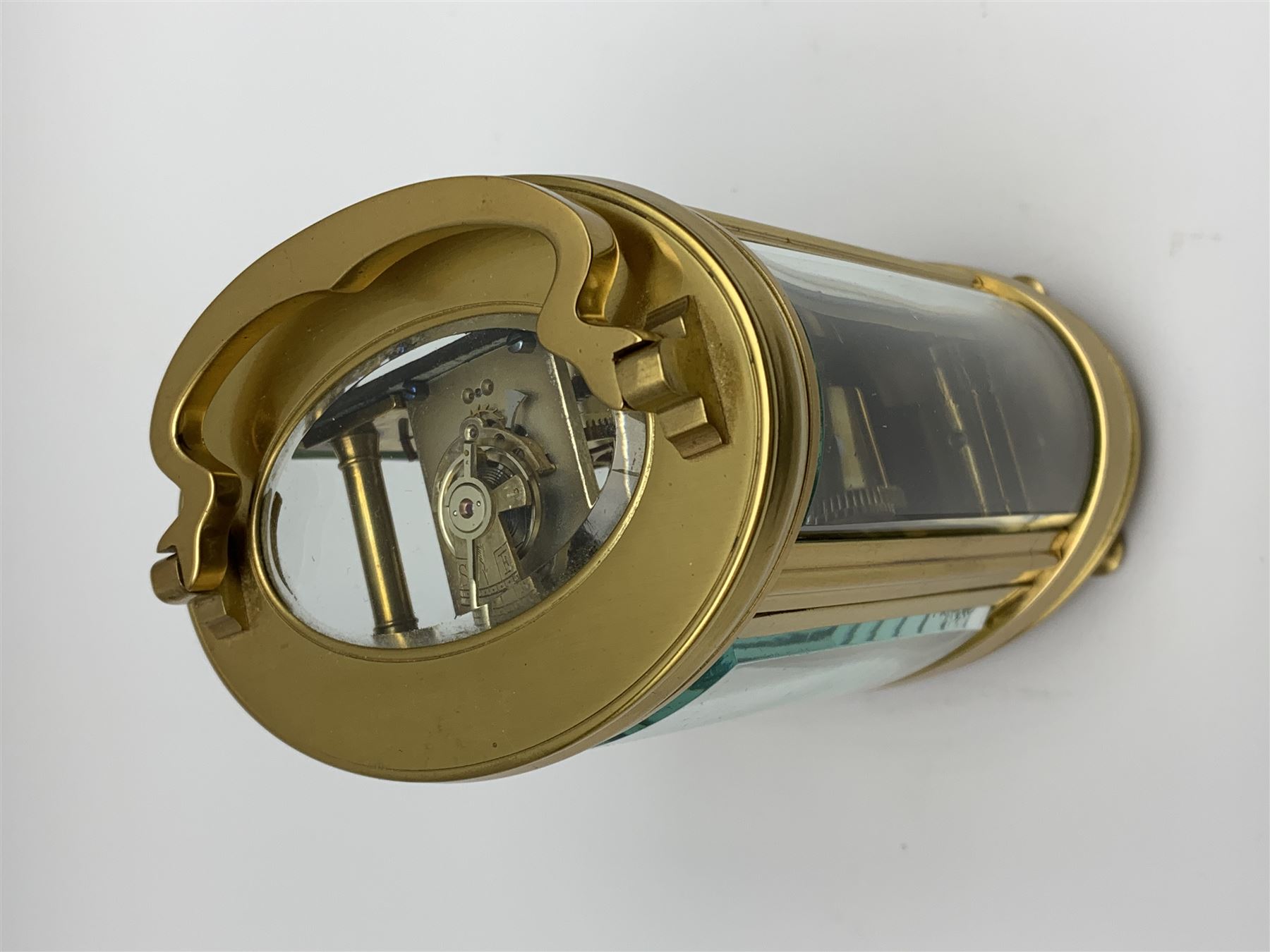 Late 20th century carriage timepiece clock, polished brass case of oval form glazed with bevelled gl - Image 4 of 5