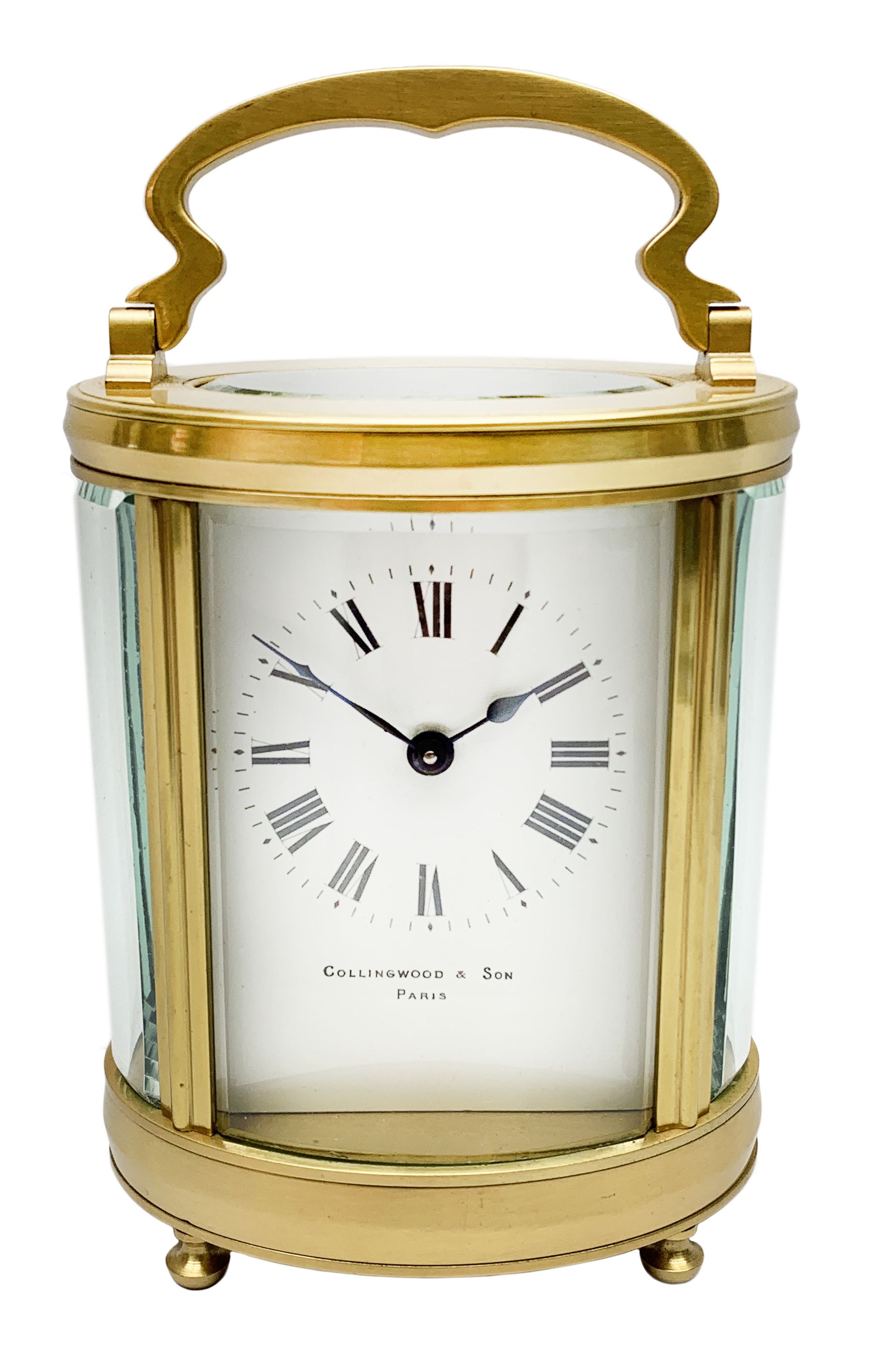 Late 20th century carriage timepiece clock, polished brass case of oval form glazed with bevelled gl