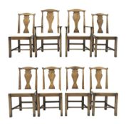 Set eight Georgian style distressed light oak chairs with upholstered removable seat pads, two carve
