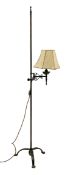 Cast and wrought metal standard lamp, single adjustable branch with a vellum shade, plain rod column