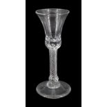 18th century drinking glass, the bell shaped bowl upon a single series basal knopped stem and conica