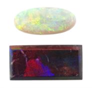 Loose rectangular black opal and a loose oval cabochon opal (2) Notes: By direct decent from Barr