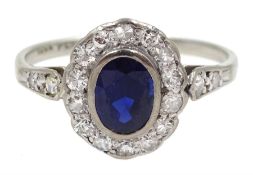 Early 20th century white gold oval synthetic sapphire and diamond cluster ring