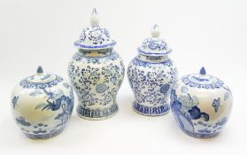 Two Chinese blue and white urns and covers