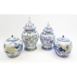 Two Chinese blue and white urns and covers