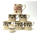 Five Emma Bridgewater mugs decorated in a stylised black band