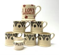 Five Emma Bridgewater mugs decorated in a stylised black band