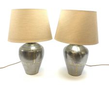 A pair of brushed steel table lamps