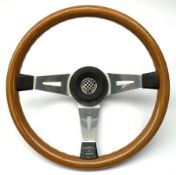 A mahogany three spoke rally steering wheel