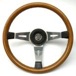 A mahogany three spoke rally steering wheel