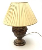 A composite wood effect table lamp