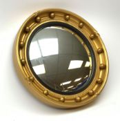A vintage Atsonea convex mirror