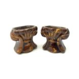 A pair of 19th century treacle glaze pottery sash window rests