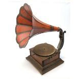 A wind up gramophone with red painted tin plate horn
