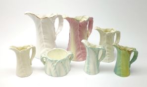 A group of six Royal Worcester leaf moulded porcelain jugs