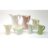 A group of six Royal Worcester leaf moulded porcelain jugs