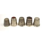 Five hallmarked silver thimbles of various sizes