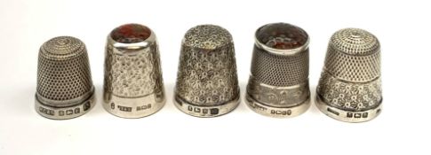 Five hallmarked silver thimbles of various sizes