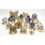 A collection of various 19th century Staffordshire pastille burners modelled in the form of building