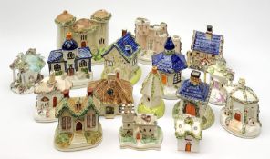 A collection of various 19th century Staffordshire pastille burners modelled in the form of building