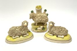 A 'Staffordshire' garniture modelled as sheep