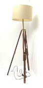 A mahogany and brass mounted tripod standard lamp