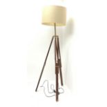 A mahogany and brass mounted tripod standard lamp