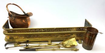 An early 20th century brass fire fender