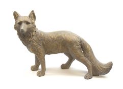 A composite figure modelled as a standing fox