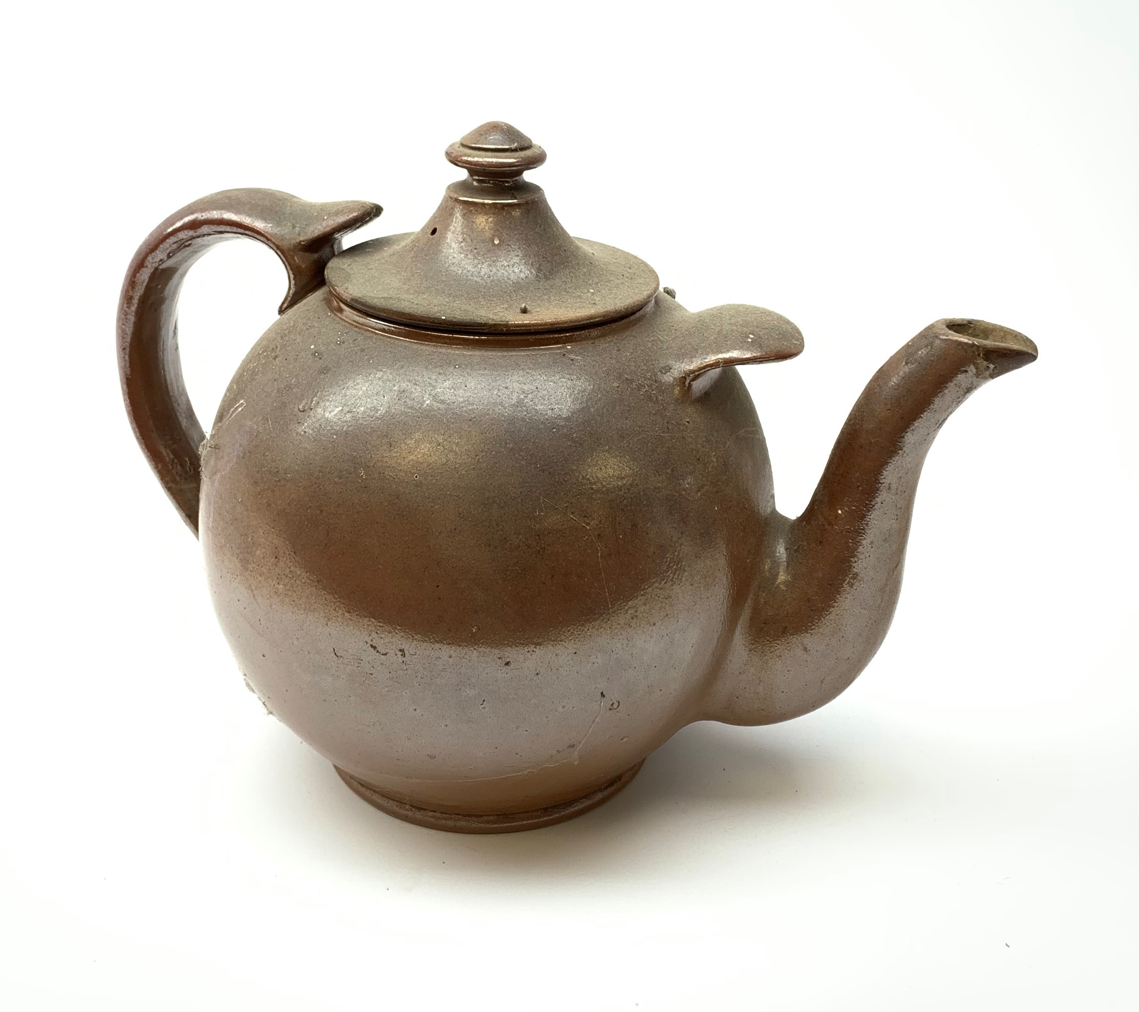 A large 19th century salt glazed teapot