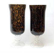 Two large glass hurricane lamps