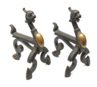 A pair of Victorian cast iron and copper fire dogs