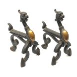 A pair of Victorian cast iron and copper fire dogs