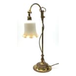 A brass rise and fall students lamp