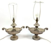 A pair of silver plated table lamps