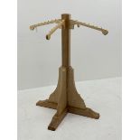 Light ash wood clothes stand, four out splay branches, on cruciform base, H128cm, W100cm