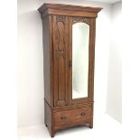 Edwardian walnut narrow single wardrobe, projecting cornice over single bevelled mirror glazed door,