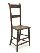 Victorian beech framed child�s deportment correction chair, turned supports, cane work seat, total h