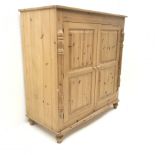 Solid pine cupboard/wardrobe, two doors enclosing single hanging rail, turned supports, W123cm H131c