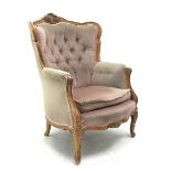 20th century beech framed French style armchair, the shaped and moulded frame carved with foliate ca