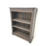 Victorian heavily carved oak bookcase, rectangular top with carved and moulded edge, flower head lun