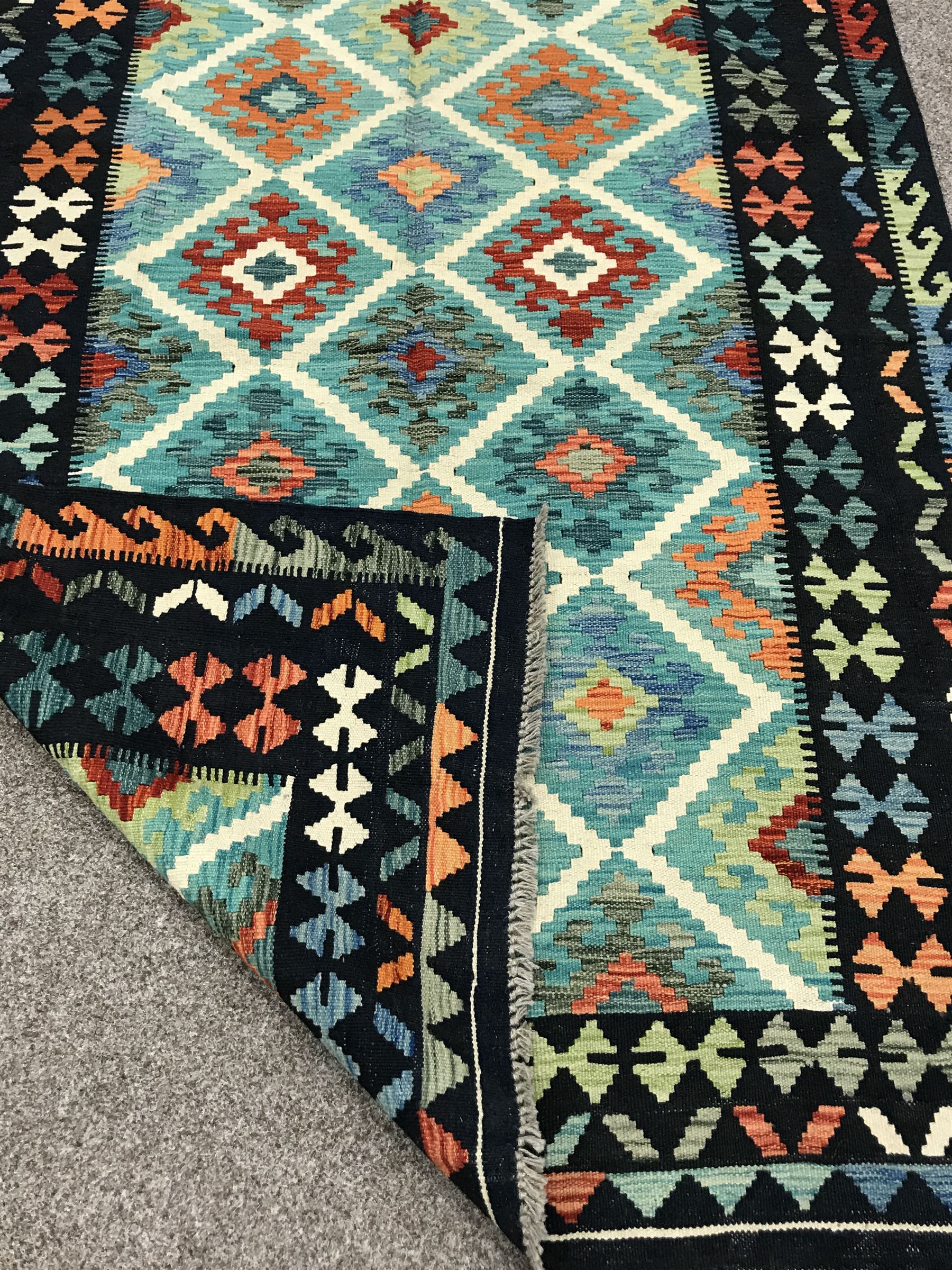 Choli Kilim blue ground rug, geometric patterned repeating border - Image 3 of 3