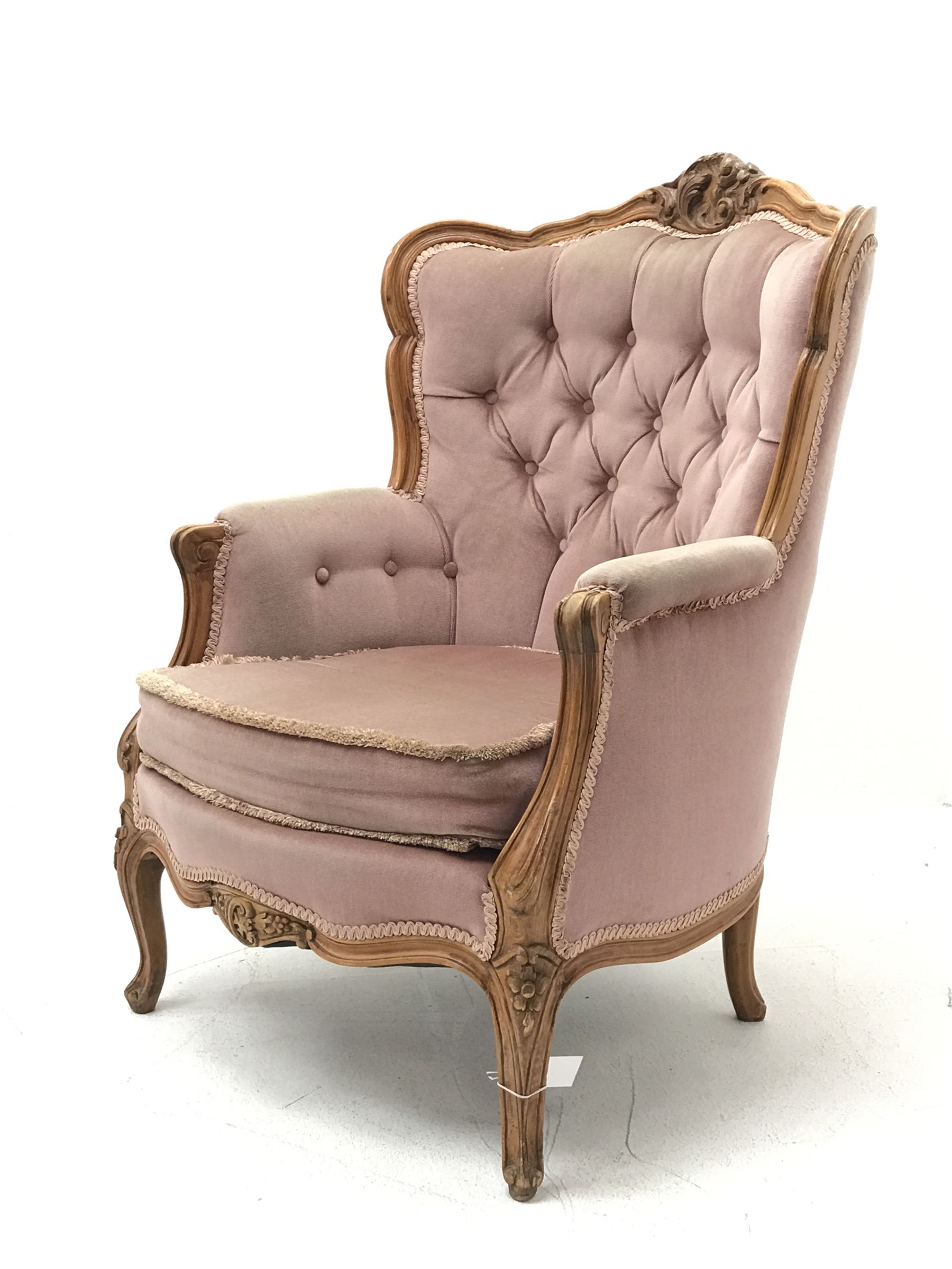 20th century beech framed French style armchair, the shaped and moulded frame carved with foliate ca