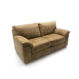 Two seat sofa bed upholstered in tan leather