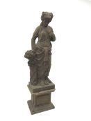 Hand carved stone classical female figure carrying flowers on plinth base