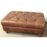 Large rectangular footstool upholstered in a deep buttoned fabric, turned supports
