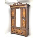 Late Victorian walnut wardrobe, scrolled pediment with central carving, enclosed by single bevelled