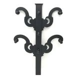 Victorian black painted mahogany coat stand, four shaped supports with seven pegs, H131cm, W89cm